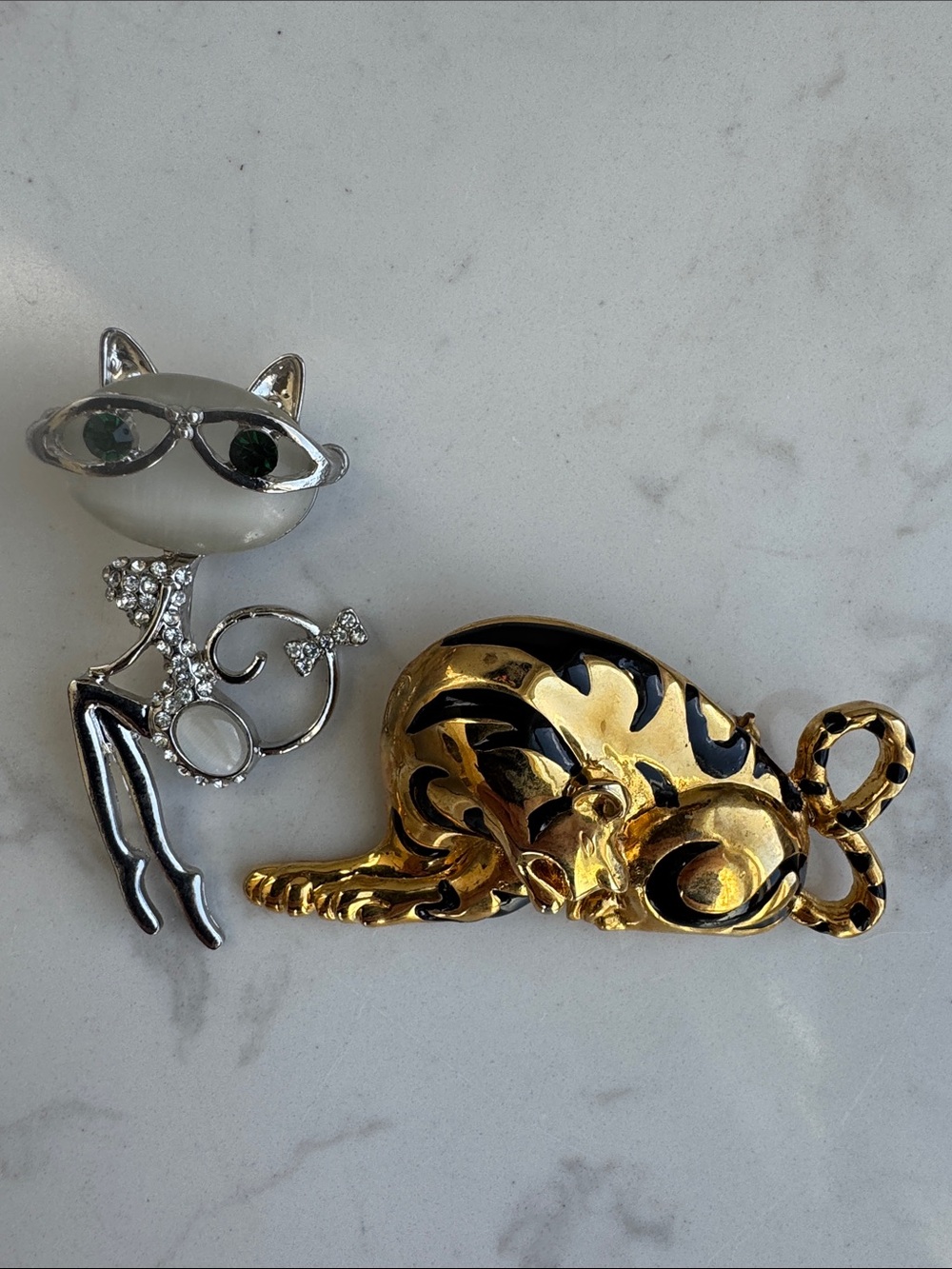 Vintage gold-tone and black enamel crouching tiger and silver tone cat brooch